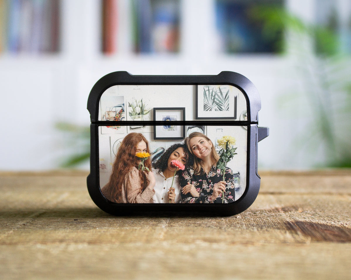 A custom AirPods  Pro 1st 2nd or 3rd Gen photo printed on a black protective case for wireless earbuds, displayed on a wooden tabletop with a blurred indoor background.