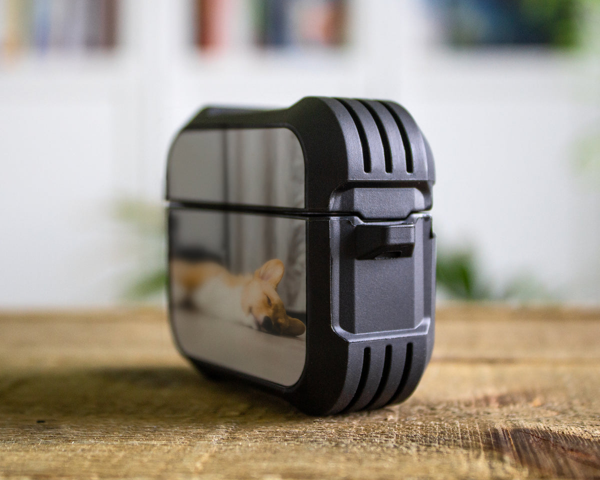 A custom pet portrait printed on a protective Pro 1st 2nd or 3rd Gen rubber case, resting on a rustic wooden table with a blurred indoor background.