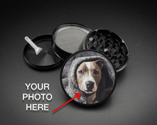 Personalized black four-piece herb grinder with a custom dog photo on the glossy lid, magnetic grinding chamber, mesh screen, collection chamber and scraper.