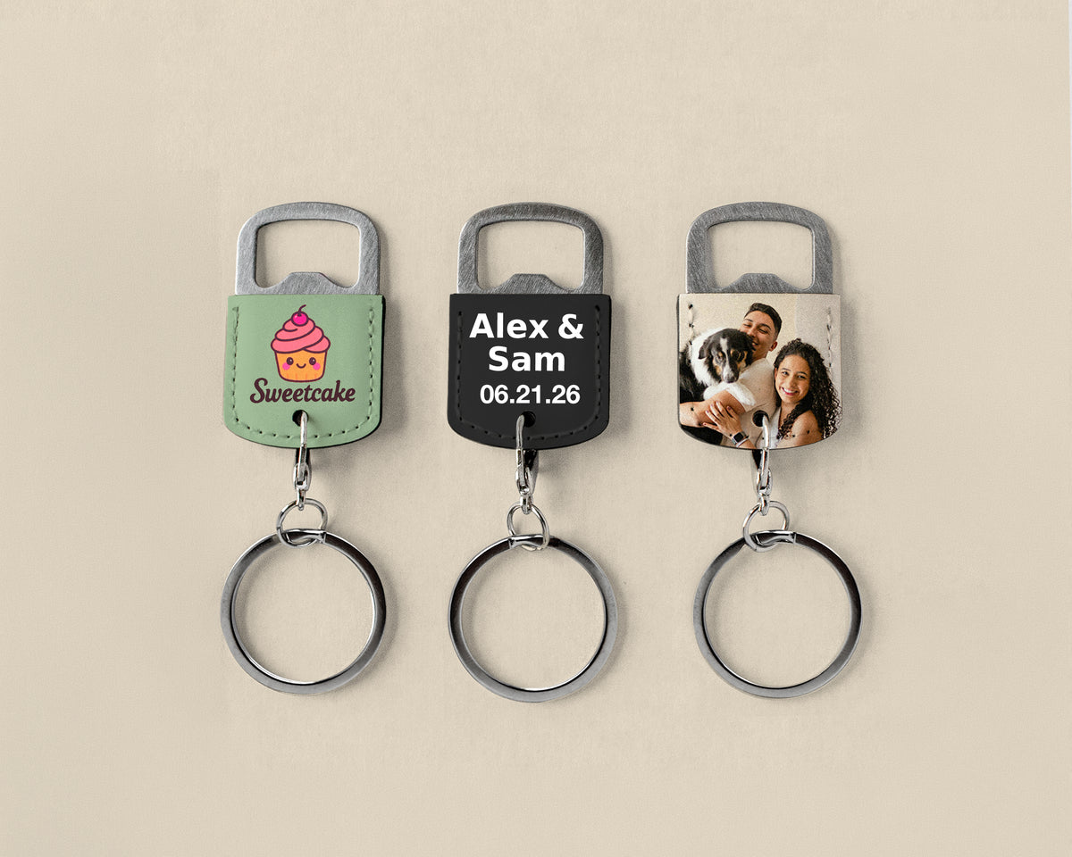 Three personalized leather keychains with metal bottle opener tabs and key rings, displayed on a light beige background. The left keychain is sage green with a pink cupcake graphic and 'Sweetcake' text.