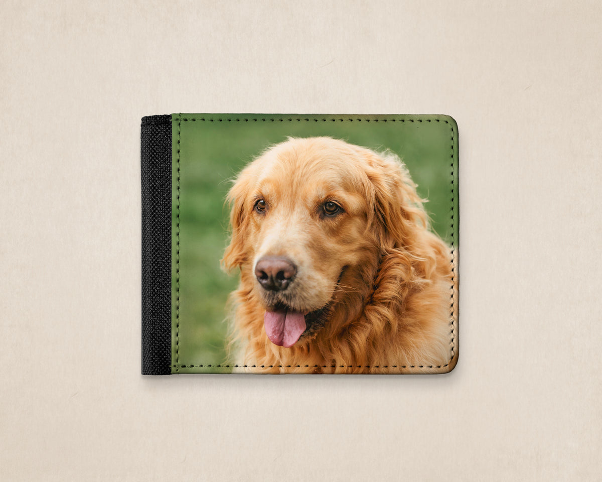 A custom-printed bifold wallet featuring a golden retriever dog on the front, with a black textured side band, displayed on a light beige background.